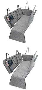 Detail showing multi-functional storage pockets and mesh window on grey car pet mat.