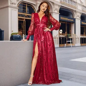 Elegant red sequined evening gown with high slit and long sleeves for formal events