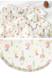 Close-up detail of cartoon dinosaur and mushroom pattern on breathable pet vest fabric