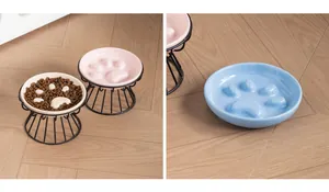 Detailed view of paw-shaped ceramic slow feeder pet bowls in pink and blue colors.