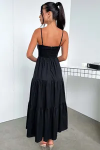 Detailed back view of an elegant black spaghetti strap tiered maxi dress for women