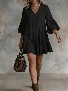 Black V-neck tiered mini dress with bell sleeves, loose summer vacation style fashion