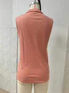 Detailed back view of a casual coral knit sleeveless tank top featuring a lapel collar