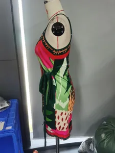 Detailed side view of vibrant tropical digital print cami dress with waist tie detail