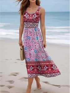 View of a bohemian floral print maxi dress featuring a high waist and beach accessories
