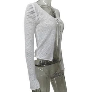 Side view of a white mesh knit long sleeve cardigan with a front tie bow on a mannequin