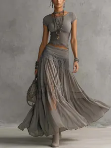 Full view of the elegant grey knitted top and flowing chiffon maxi skirt set for women