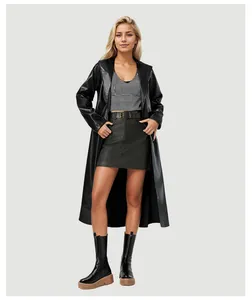 Full body view of a stylish long black faux leather trench coat with belt for women
