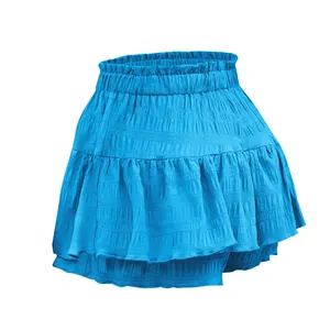 Detail view of women's blue ruffled skort showing smocked texture and elastic waistband