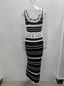 Detail view of a black and white striped knitted two-piece set with crop top and skirt
