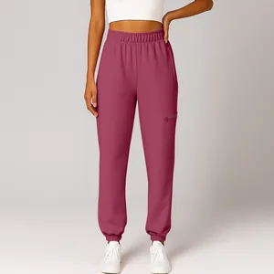 Women's mauve high-waisted joggers with elastic cuffs and side zipper pocket