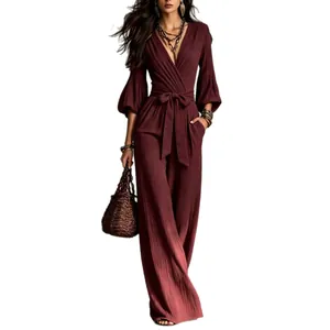 French style deep V-neck puff sleeve jumpsuit with high waist belt and wide-leg trousers.