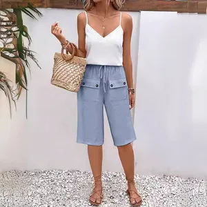 Women's casual blue cargo shorts featuring a drawstring waist and large buttoned pockets