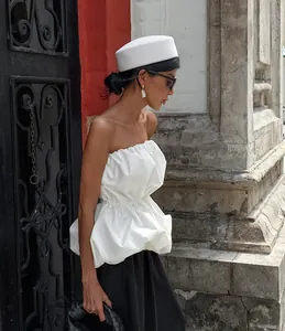 Chic white strapless peplum top with ruffled waist for summer high-end fashion look