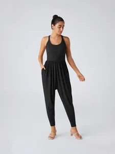Elegant sleeveless black women's one-piece jumpsuit with tapered legs and gathered waist