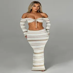 Elegant two-piece crochet striped set featuring halter top and matching maxi skirt