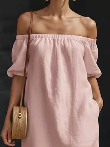 Close-up of pink cotton linen off-the-shoulder dress with elastic neckline detail