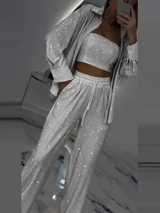 Glittering silver sequined three-piece set featuring long shirt, tube top, and loose pants