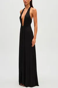 Side profile view of an elegant black halter neck maxi dress with plunging neckline.