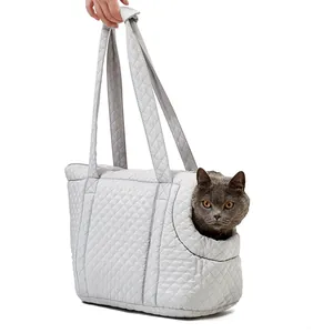 Premium quilted gray pet carrier handbag featuring long shoulder straps and cat head opening