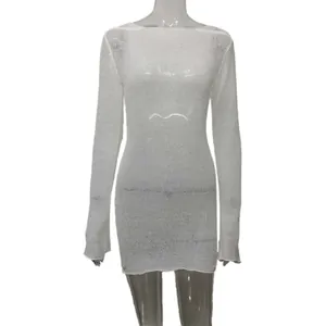 Close-up view showing the sheer white knitted texture of this summer beach cover-up dress.