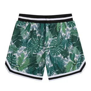 Close-up view of the green tropical leaf pattern and breathable mesh fabric detail