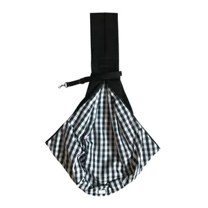 Close-up detail of a black pet sling carrier bag with a stylish black and white checkered lining.