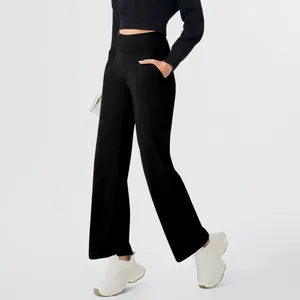 Detailed side view of black high-waisted yoga pants featuring functional side pockets.