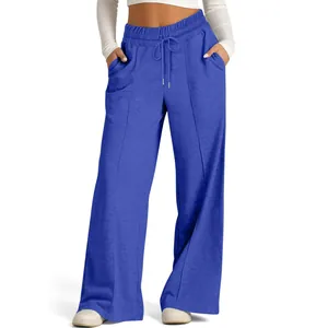Close-up of bright blue wide-leg sweatpants with drawstring and elastic waist