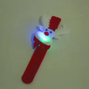 Close-up of a glowing Christmas reindeer slap bracelet with LED lights on a white background.