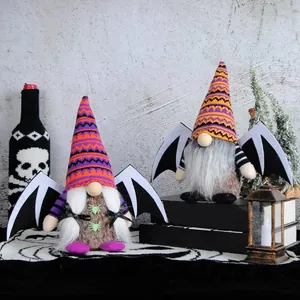 Adorable Halloween bat wing gnome plush dolls with striped knit hats and spider details.