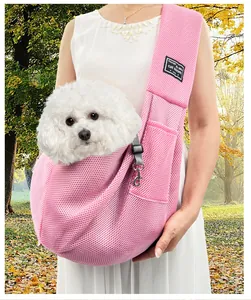 Detail view of pink breathable mesh pet sling carrier featuring interior safety hook