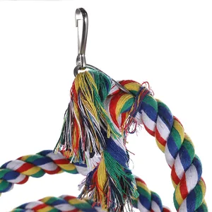 Close-up detail of a colorful cotton bird climbing rope toy featuring a durable metal hook
