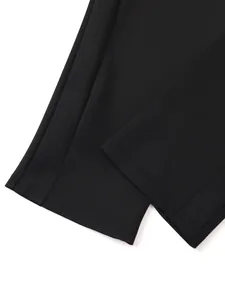 Detail view of black sports trousers leg cuffs featuring high-quality double-stitched hem.
