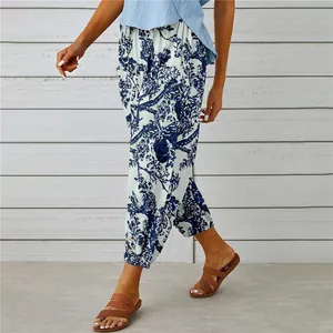Close-up detail of women's vintage blue floral print cotton linen high waist pants