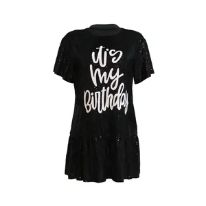 Front view of black sequin dress featuring 'it's my Birthday' print and ruffled hem