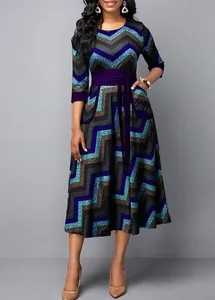 Detailed view of women's round neck chevron print maxi dress with purple waist belt and pockets