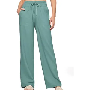 Close-up of women's high-waisted linen wide-leg pants with drawstring and pockets
