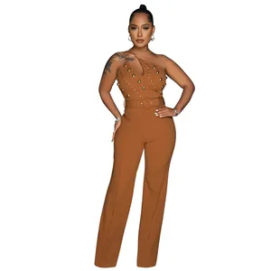 Elegant brown one-shoulder jumpsuit with gold studs, belt and wide-leg design