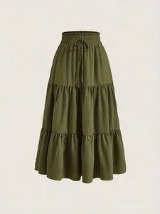 Detailed view of olive green tiered maxi skirt featuring elastic drawstring waist