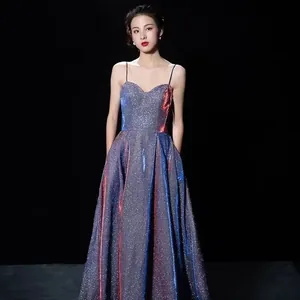 Elegant sparkly spaghetti strap evening gown with deep V-neck and shimmering fabric details.