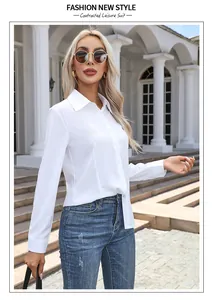 A professional outdoor shot of a woman wearing a white long-sleeved casual button-down shirt.