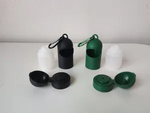 Detailed view of portable pet sanitizer dispenser components in black and green