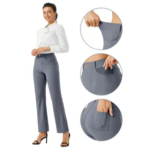 Detail view of grey high-waisted straight-leg yoga trousers with elastic waist and pockets.
