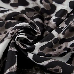 Macro view of the high-quality leopard print fabric texture for autumn wide leg trousers