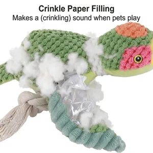 Green bird-shaped plush dog toy featuring a cotton rope and loud internal crinkle paper