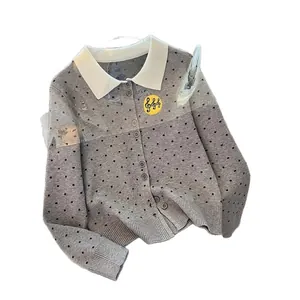 Grey polka dot knitted cardigan featuring white collar and music note badge embroidery.
