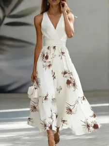 Detailed view of the elegant white floral maxi dress with sexy V-neck and sleeveless cut.