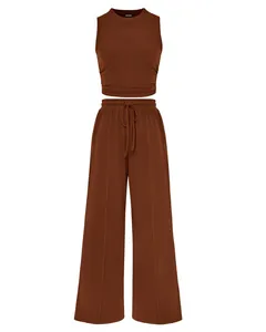 Two-piece brown ribbed knit set featuring a sleeveless tank top and wide-leg drawstring pants
