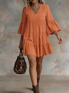 Boho style orange linen tiered dress with V-neck and tiered ruffle sleeves for summer